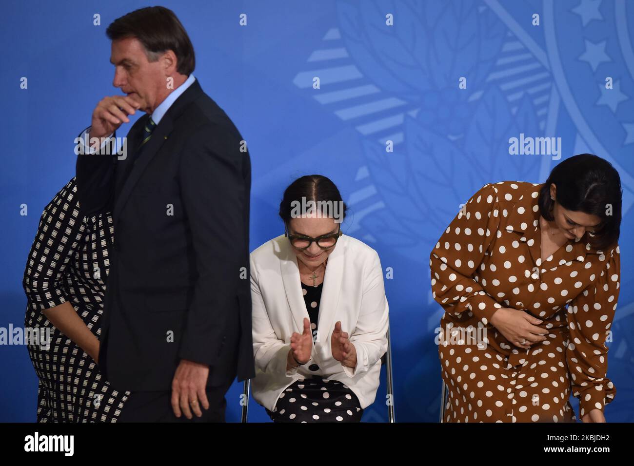 Alongside President Jair Bolsonaro, famous Brazilian novel actress, Regina Duarte, reacts during her inauguration ceremony as new Brazil`s Culture Secretary, at the Planalto Palace in Brasília, Brazil on March 4, 2020. Duarte takes over from Roberto Alvim, who was fired in January after publishing a video with references to Nazi cultural propaganda. (Photo by Andre Borges/NurPhoto) Stock Photo